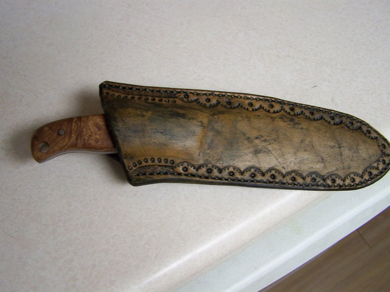 Afzelia_burl_camp_knife_with_leather_sheath.JPG