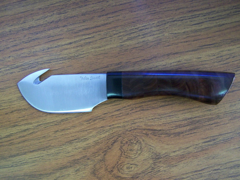 Guthook_Skinner__O1_with_stacked_walnut_handle_and_ebony_guard1.jpg