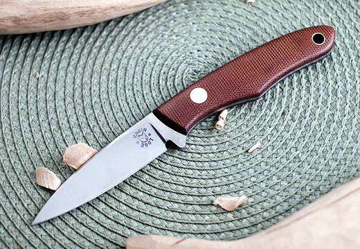 Tom Krein Ultimate Caper with brown canvas micarta with black liners